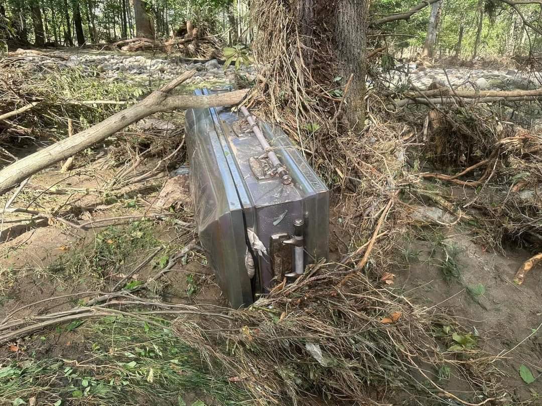 Casket unearthed by Hurricane Helene damage